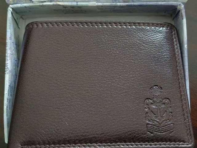 Leather wallet embossed with the Indian Navy insignia, a parting gift from Vice Admiral Sameer Saxena, 2024